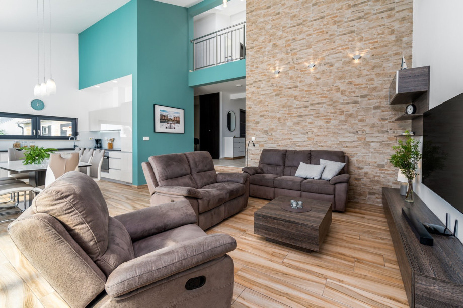 Tastefully furnished living area with exit to pool