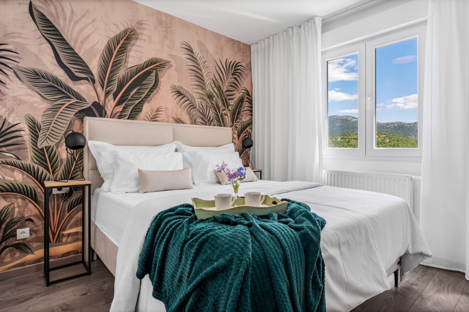 Bedroom No1 with a queen-size bed 160cm x 200cm, a flat screen TV, and an en-suite bathroom, views of the pool