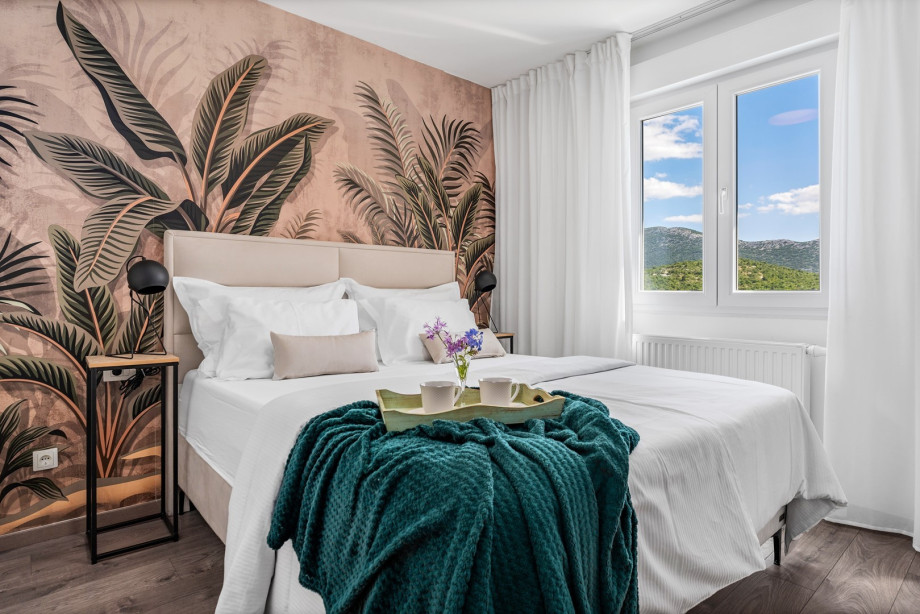 Bedroom No1 with a queen-size bed 160cm x 200cm, a flat screen TV, and an en-suite bathroom, views of the pool