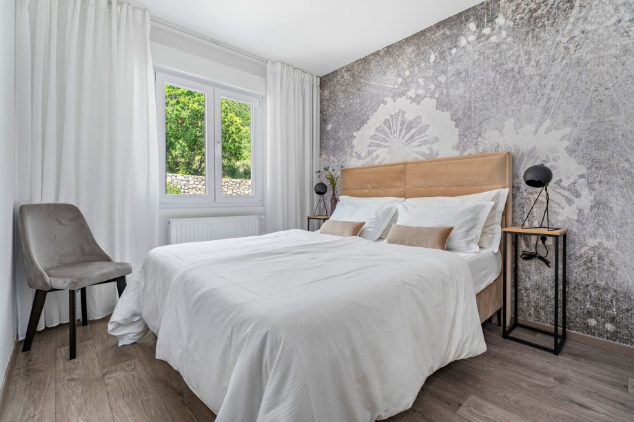 Bedroom No2 with queen-size bed 160cm x 200cm and views of the natural environment