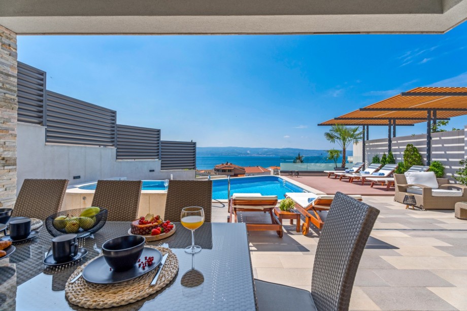 Outdoor covered dining area with amazing sea view