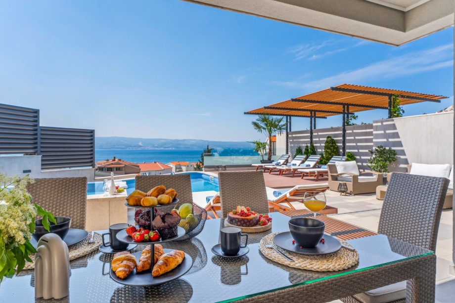 Outdoor covered dining area with amazing sea view
