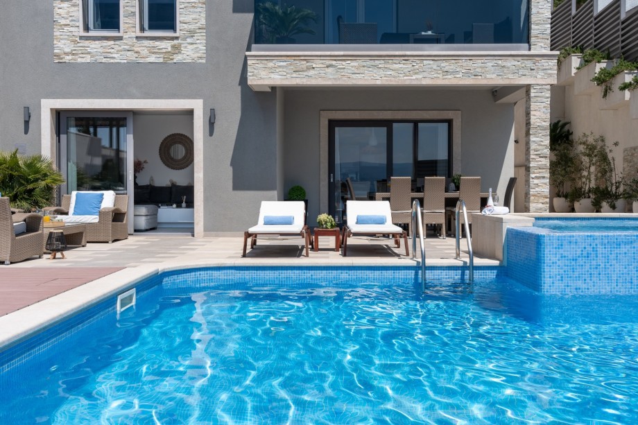 Direct exit to the pool area from the living room and dining area