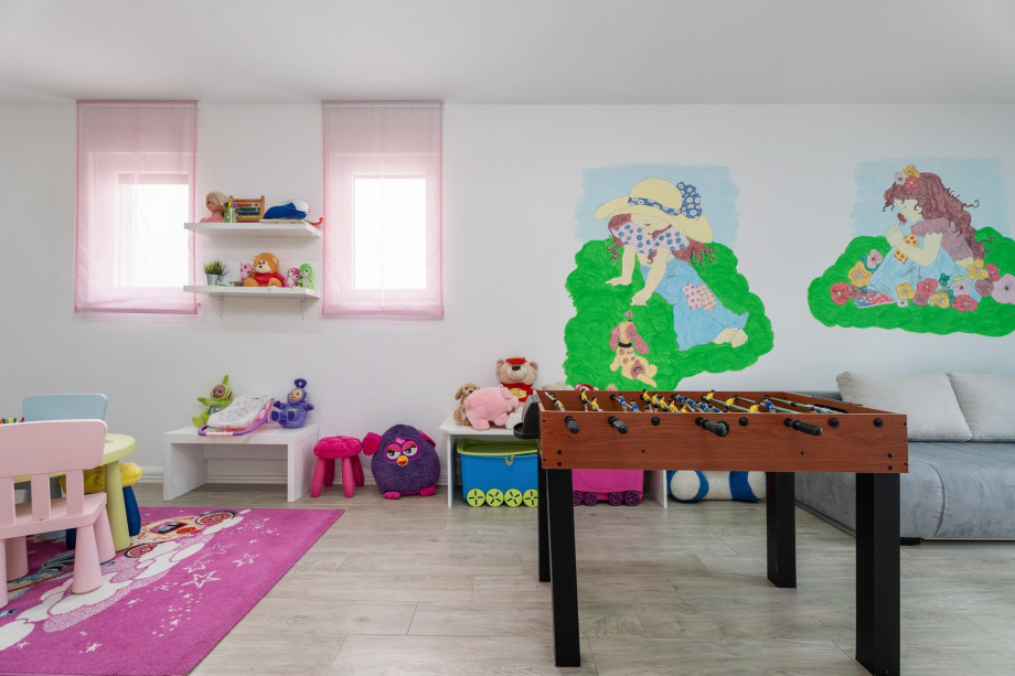 Playroom with a lot of toys, table soccer, play console, sofa bed for two, 1st floor