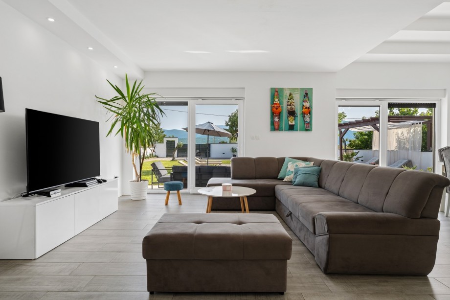 The ground floor consists of a very comfortable, air-conditioned living room with sofa