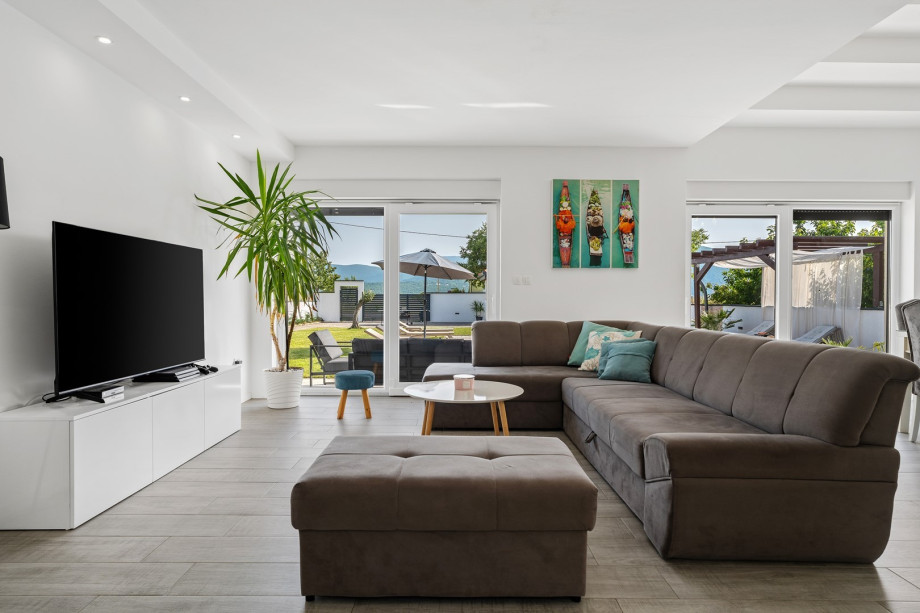 The ground floor consists of a very comfortable, air-conditioned living room with sofa