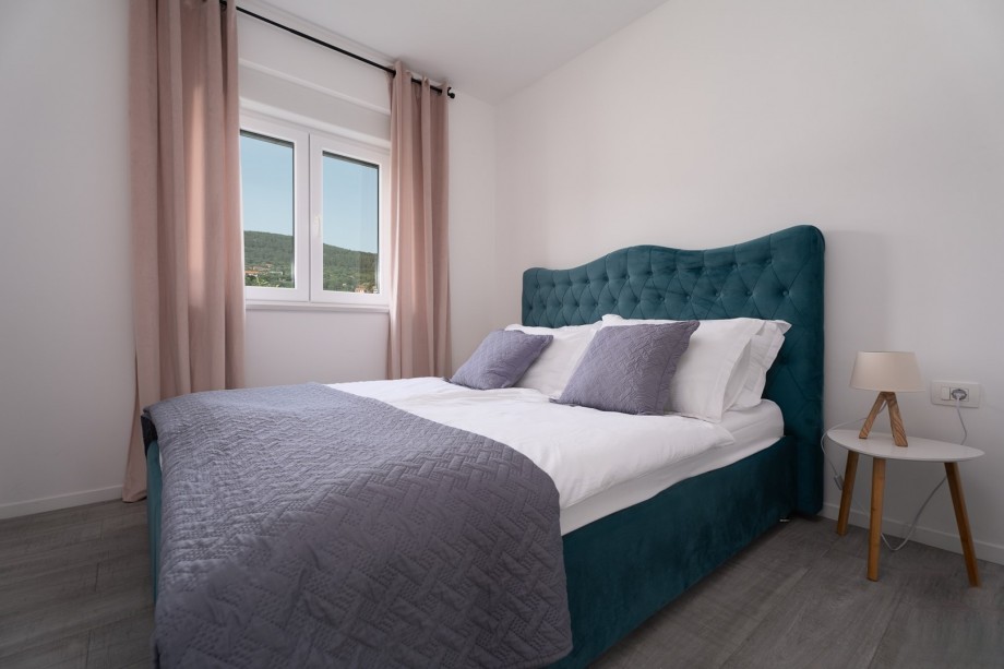 Bedroom No2 with king-size bed 180cm x 200cm and views on the pool area.