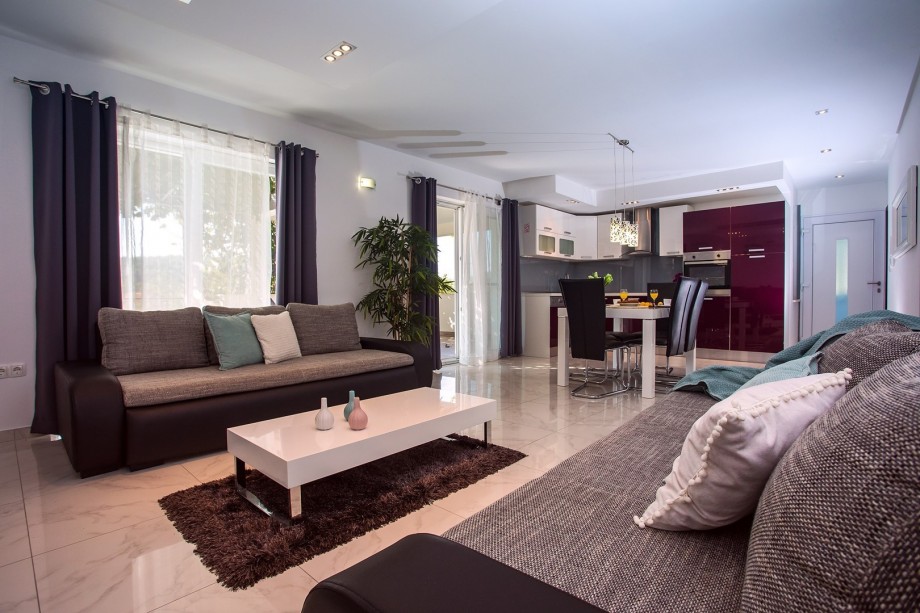 Living and dining area with kitchen and exit to the terrace