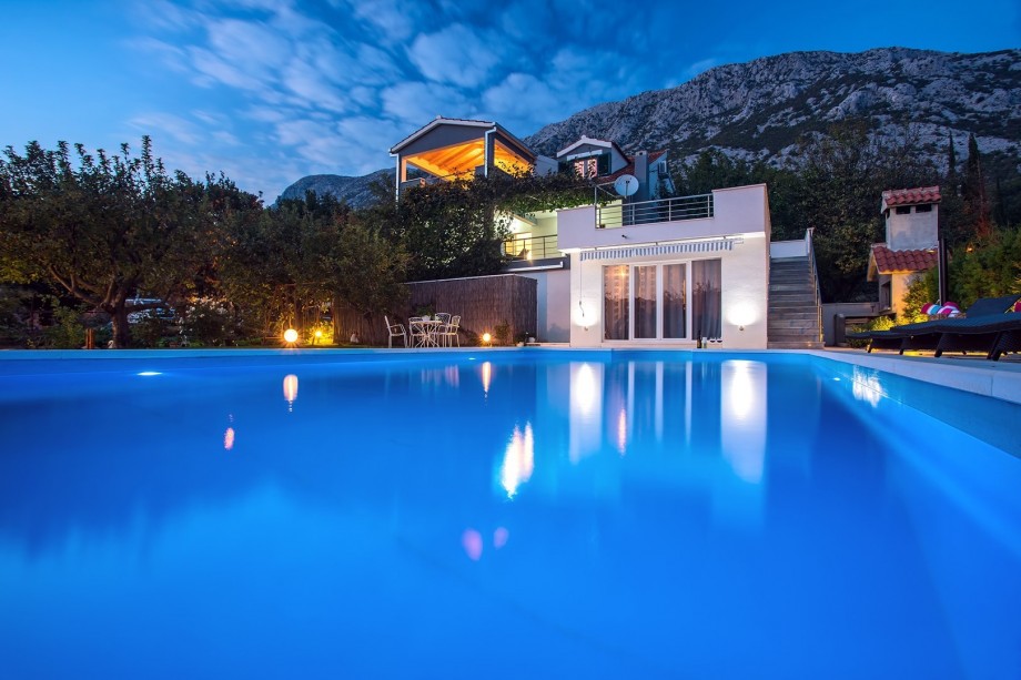Huge 10m x 5m pool in front of the villa at night