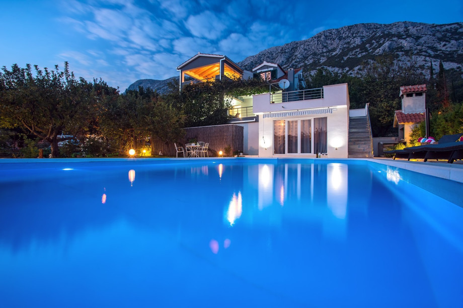 Huge 10m x 5m pool in front of the villa at night