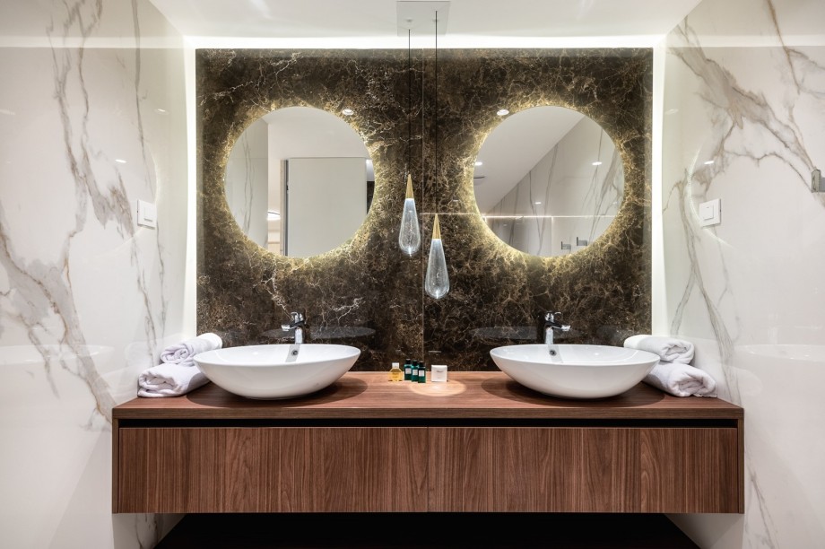 A Family bathroom with two sinks and a shower