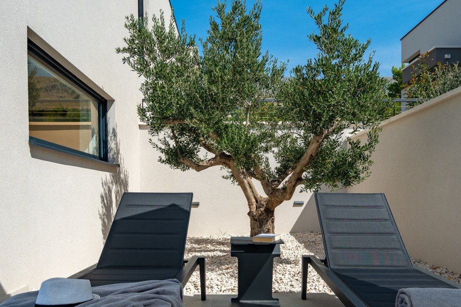 Private and relaxing sun deck by the pool