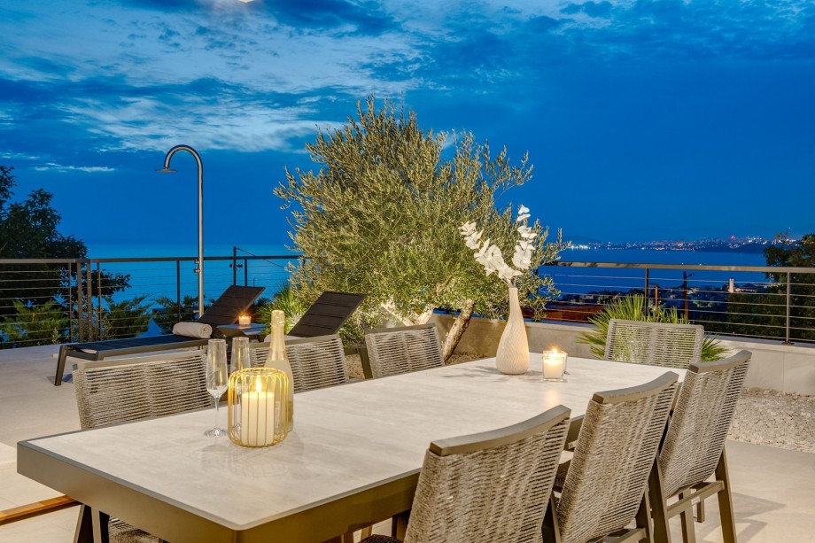 Covered dining area for 8 people and a very comfortable sun deck area all with sea views