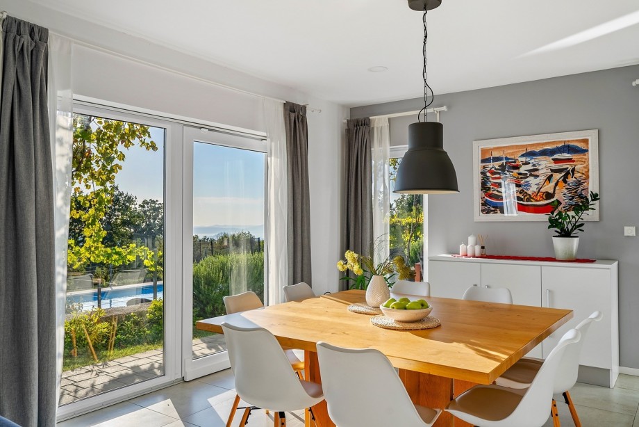 Dinning and living area with exit to the pool