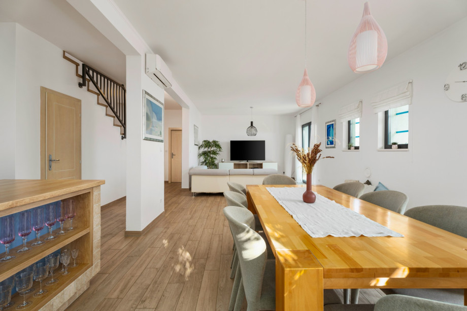 Ground floor with kitchen, dining and living area, and toilet