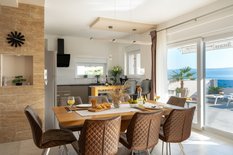 Completely air-conditioned living and dining area, with fully equipped kitchen