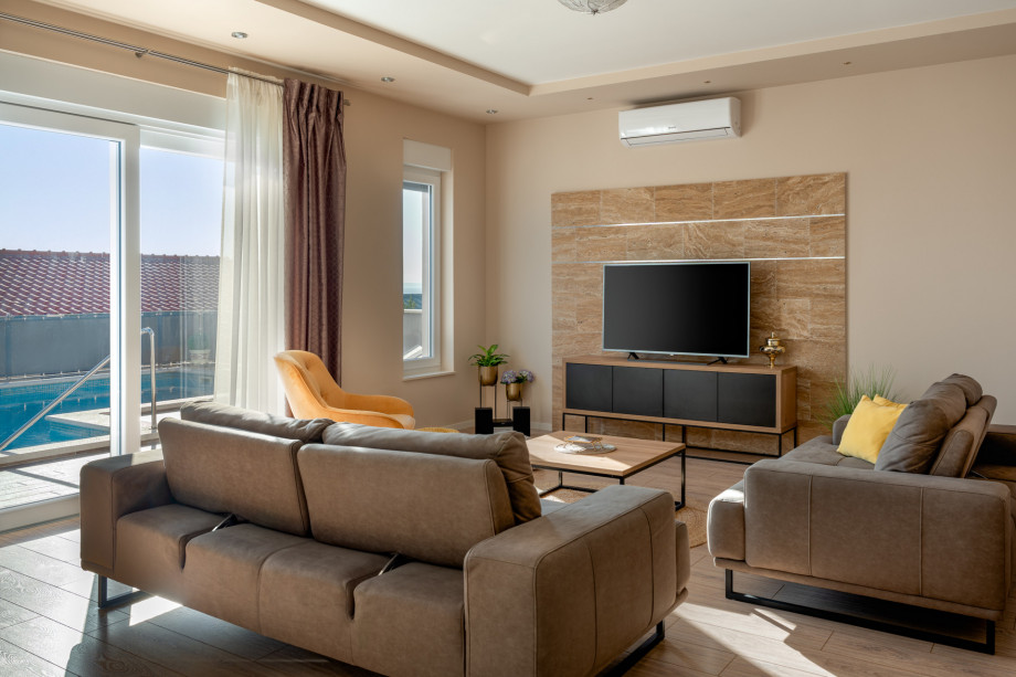 The ground floor with glass walls in the living and dining room