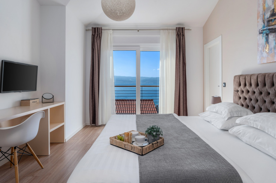 Bedroom No3, exit to the covered terrace with furniture