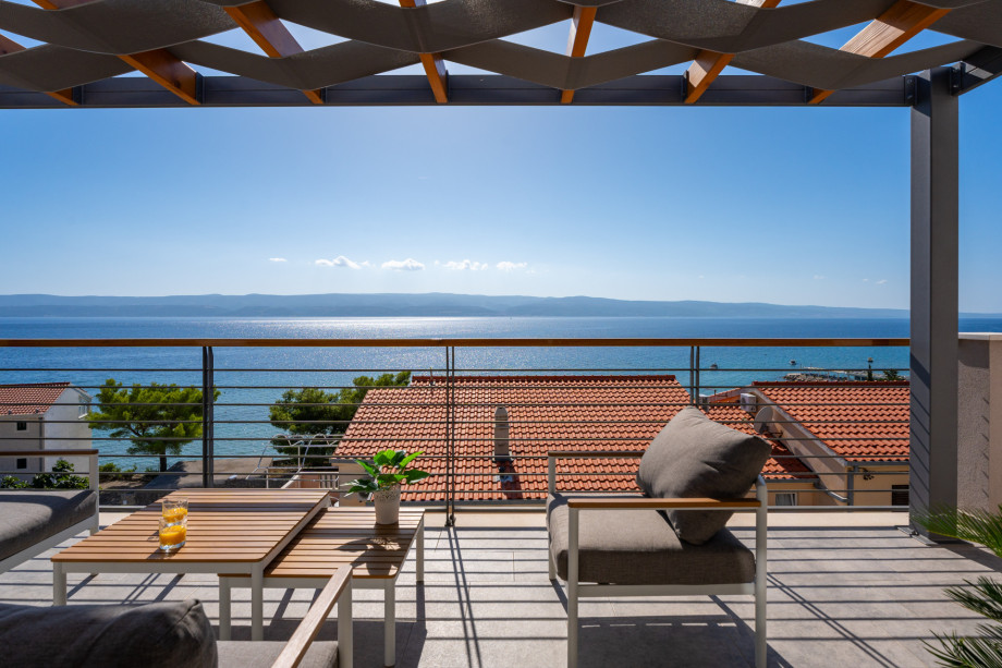 Covered terrace with sea views and outdoor furniture (Bedroom 3 and 4)
