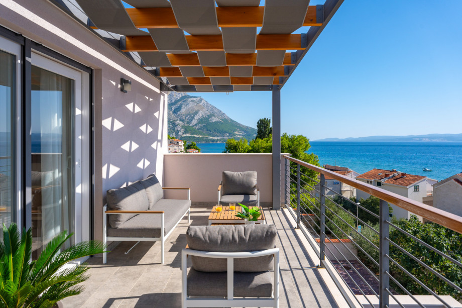 Covered terrace with sea views and outdoor furniture (Bedroom 3 and 4)