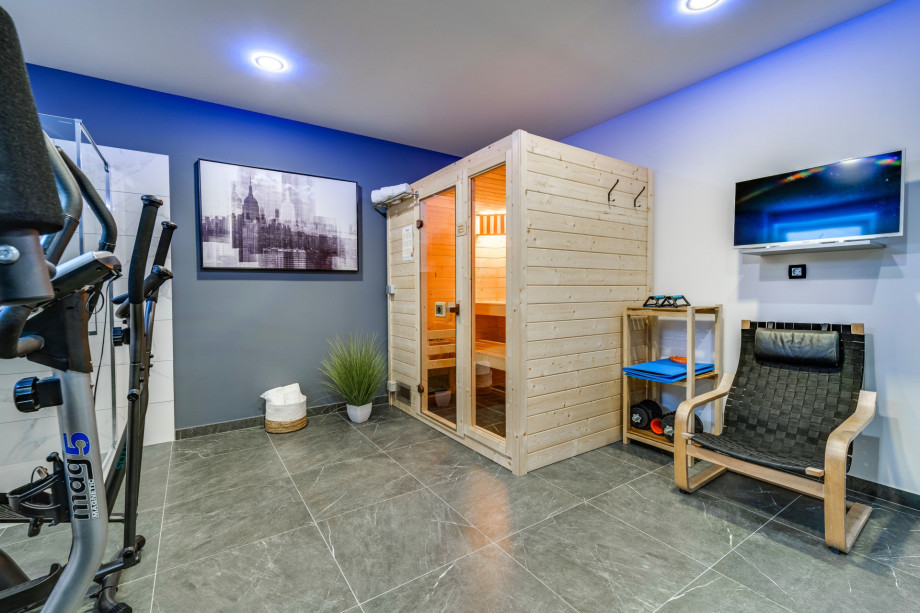 Sauna, shower, and exercise machines on the lower ground floor