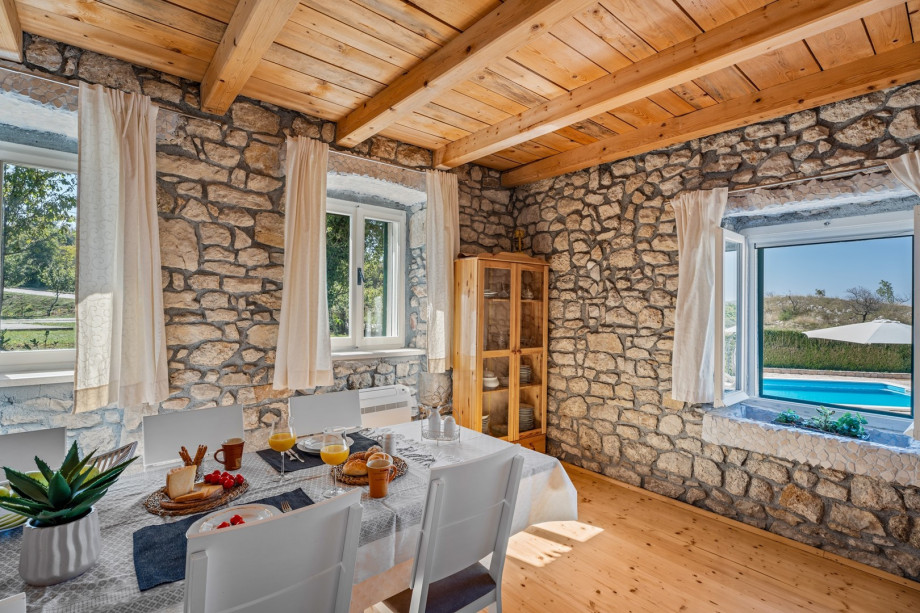 Stylish dining area with pool view