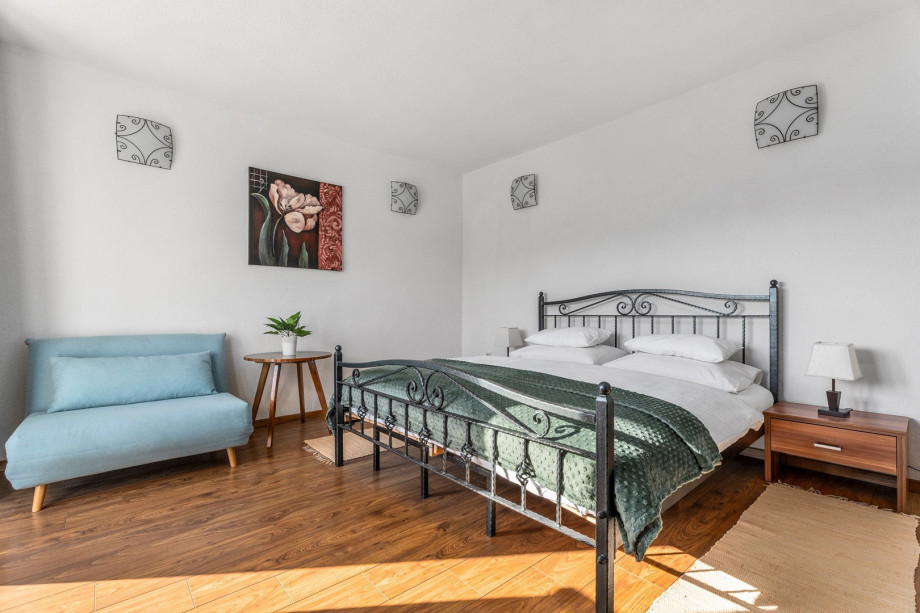 A Bedroom NO2  with a king size bed, a sofa (can convert into a sofa bed for one person), air-conditioning and a balcony with pool views