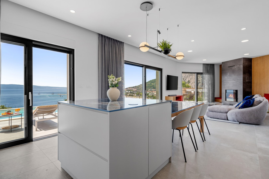 dining area with a direct approach to the pool area and open sea view