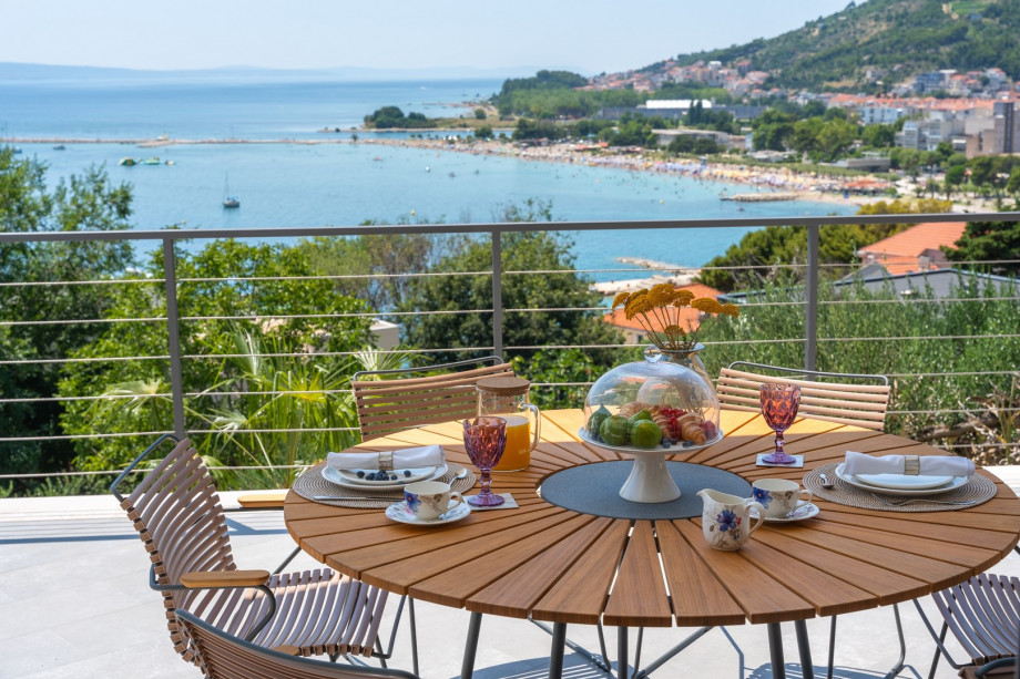 outdoor dining area next to the pool