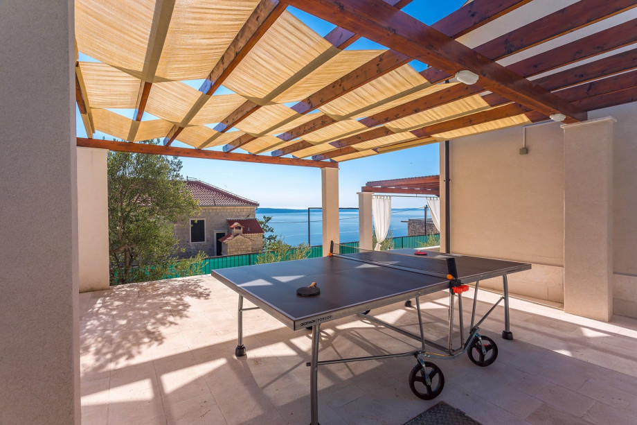 Outdoor table tennis and secured parking lot