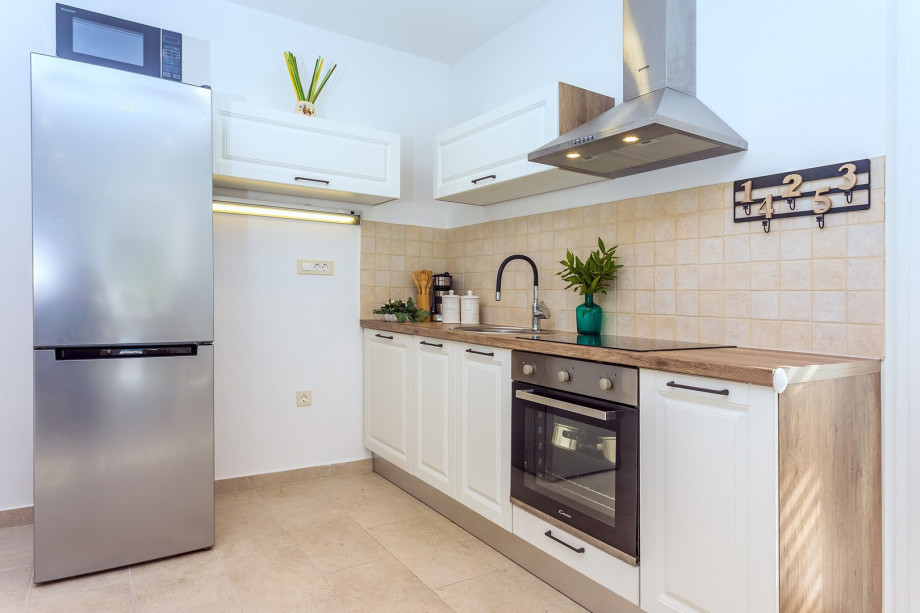 A fully equipped kitchen with all a modern guest needs for a very comfortable stay