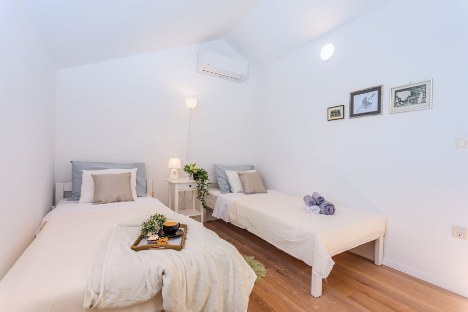 A Bedroom No2 with two single beds 90cm x 200cm, AC