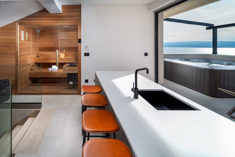 The rooftop also has a Finnish sauna, a bathroom, and kitchen island