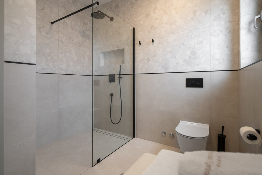 En-suite bathroom with a shower, towels are provided
