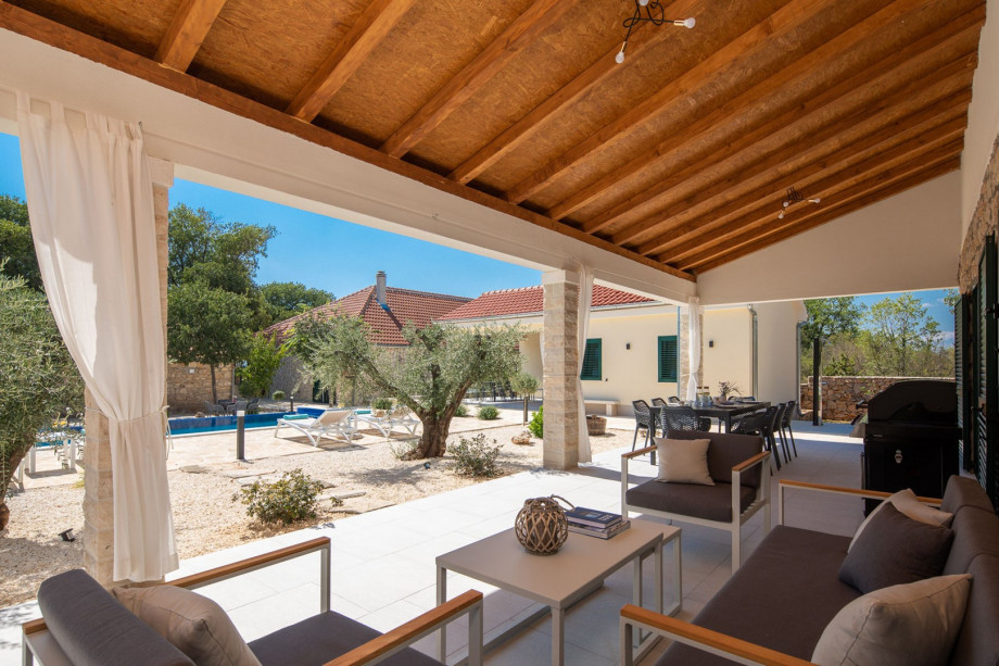 Spacious sun deck area with 6 deck chairs, an outdoor shower