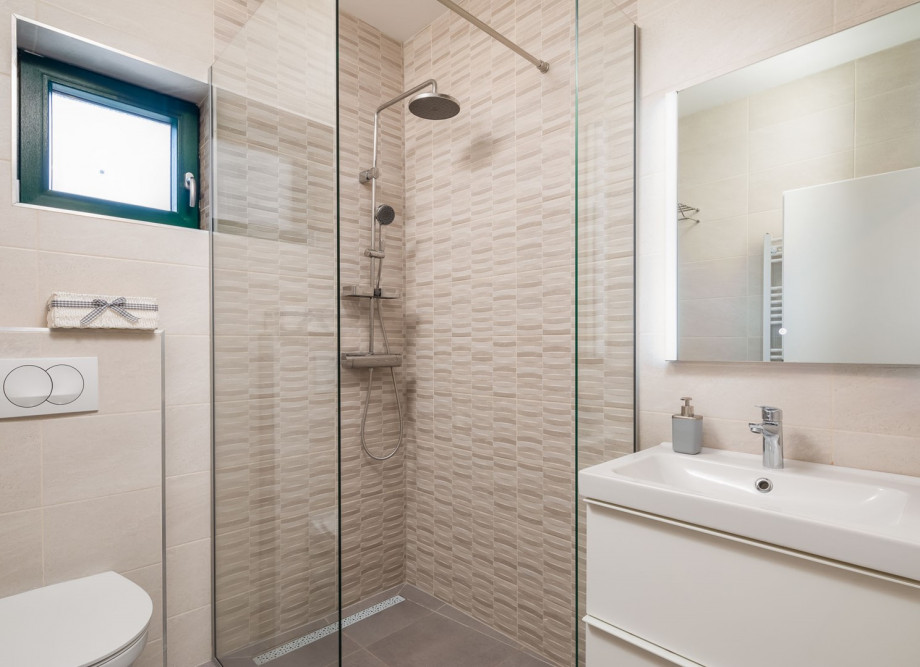 A Family Bathroom NO5 with a shower, towels are provided