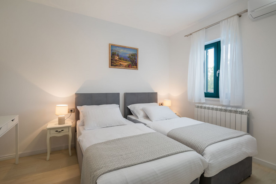 Bedroom NO6 with two single beds 90cm x 200cm, that can connect into a king size bed, A/C