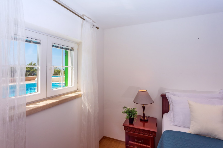 Bedroom No.2 with double bed and en-suite bathroom with shower (pool level)