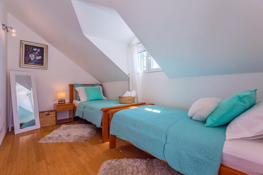 Bedroom No.4. two single beds, TV, and  bathroom en-suite with shower, terrace (west)