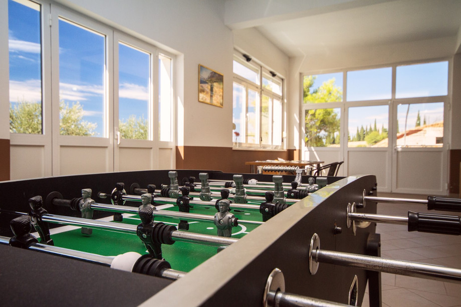 Playroom on ground floor with table football, table tennis, billiard & darts