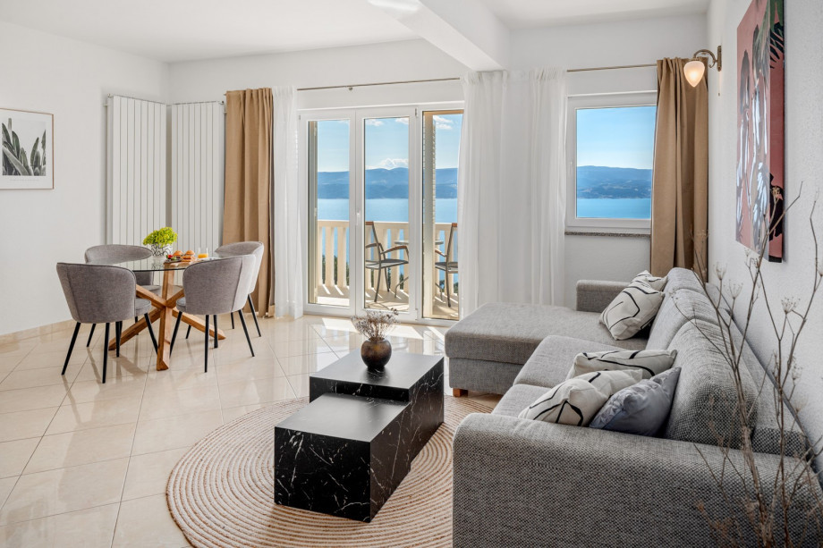Apartment No.4 on the 2nd floor offers a fully equipped kitchen, living and dining area, and an open sea view