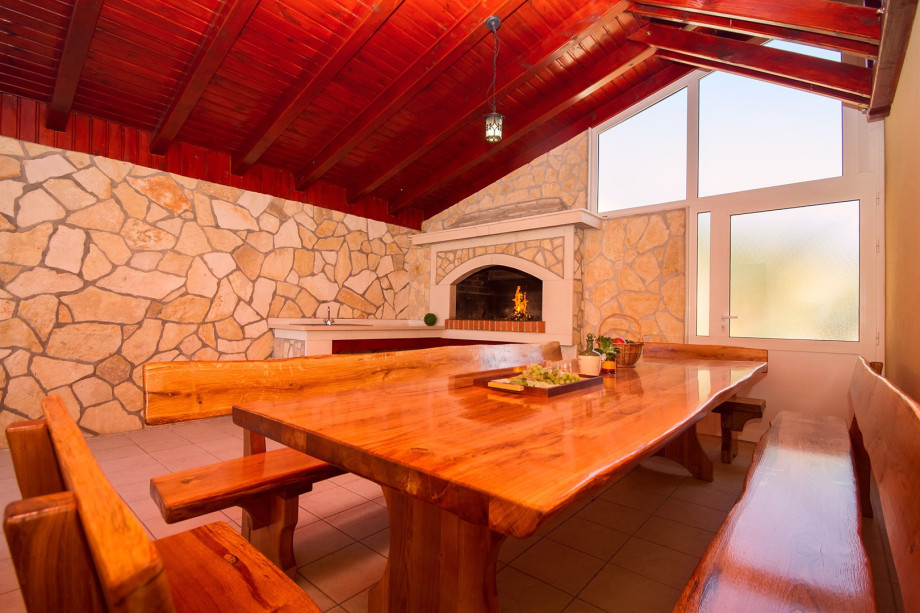 Grill and covered dining area next to the pool, dining place for 18 persons