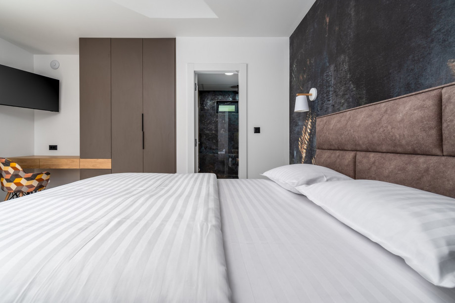 Detached, but also on the ground floor is a Bedroom No1 with a queen size bed 160cm x 200cm, air-conditioning, a TV, en-suite bathroom with the shower