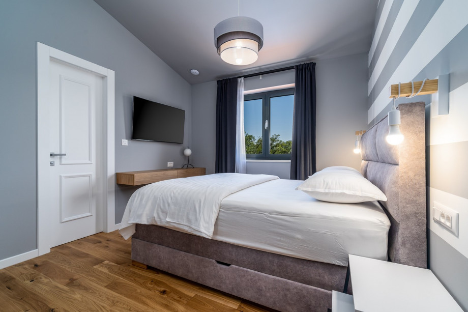 Bedroom No3 with a queen size bed 160cm x 200cm, air-conditioning, a TV, en-suite bathroom with a shower