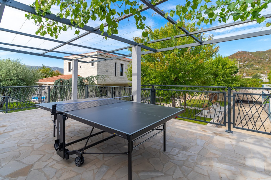 In addition, behind the house, next to the traditional bocce court that is for your use exclusively, and next to the lovely courtyard with trees