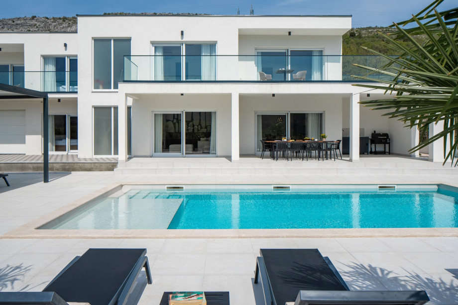 a large 47 m2 (10.5 m x 4.5 m) sparkling private pool with a ten loungers