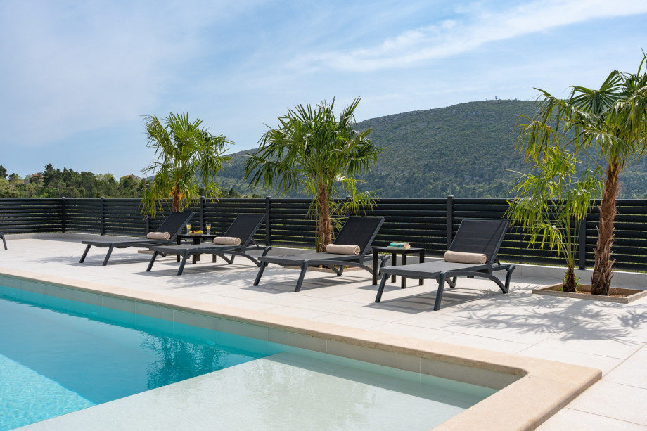 ten loungers on the inviting sun deck
