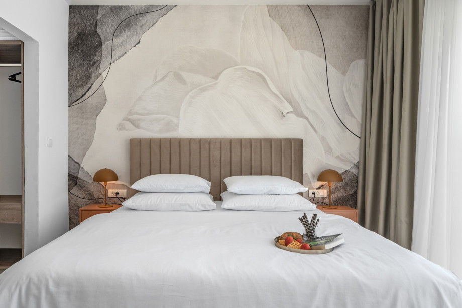 The Bedroom NO2 with a king size bed, A/C, a TV, an en-suite bathroom with a shower, and a terrace overlooking the pool and natural surroundings