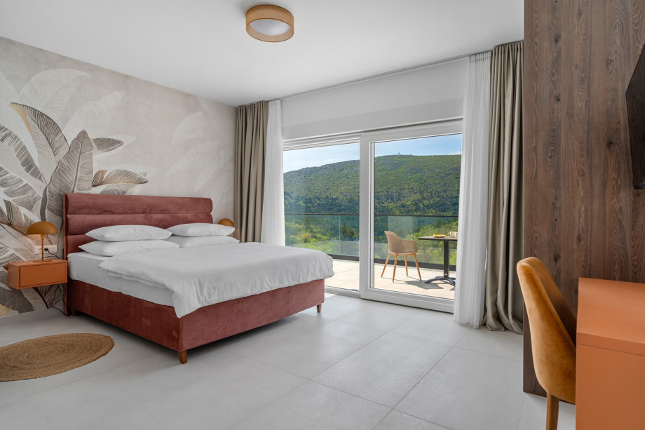 The Bedroom NO3 with a king size bed, A/C, a TV, an en-suite bathroom with a shower, and a terrace overlooking the pool and natural surroundings