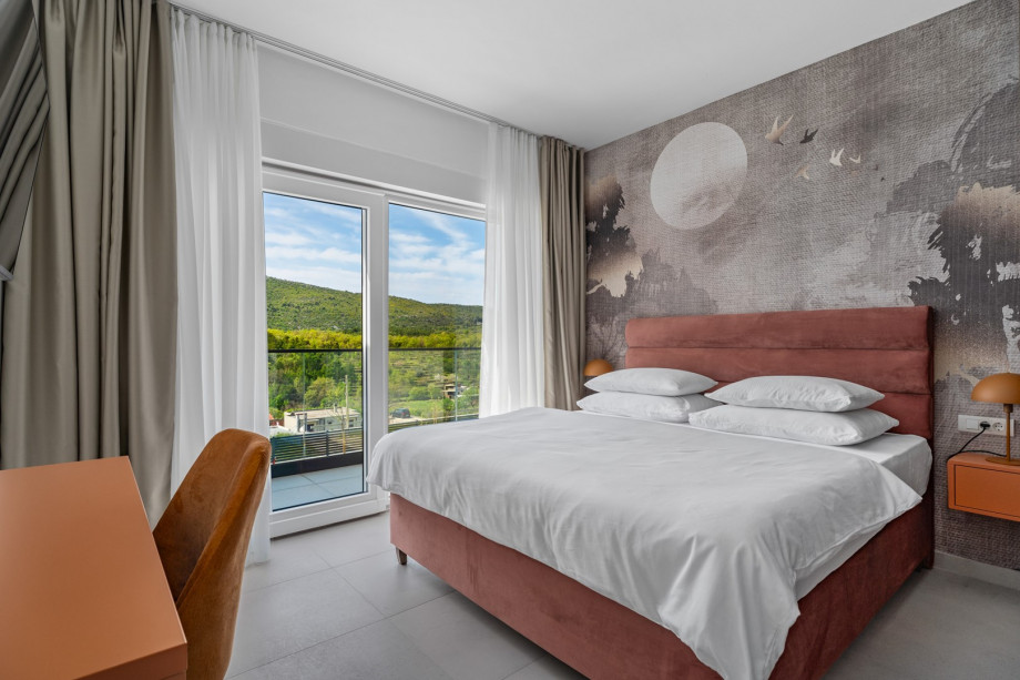 The Bedroom NO4 with a king size bed, A/C, a TV, an en-suite bathroom with a shower, and a terrace overlooking the pool and natural surroundings